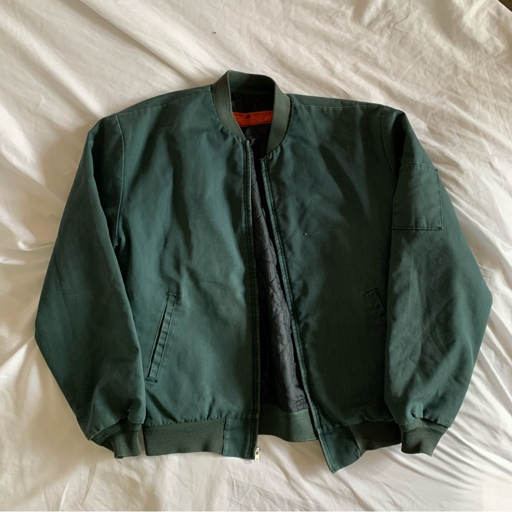green worn and used bomber work jacket
